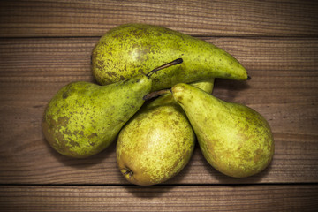 lot of pears on wooden background