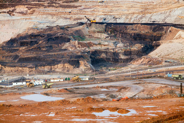 Part of a pit with big mining truck working