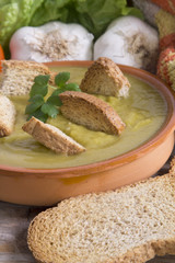 clay plate with soup and vegetable soup