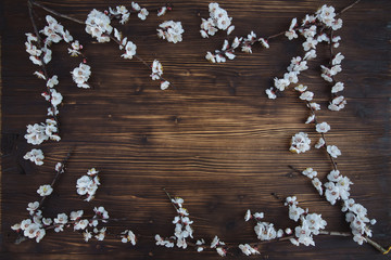 Wooden background with cherry flowers on it
