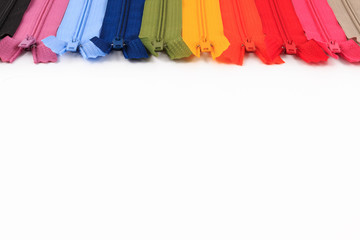 Colorful Zippers in different colors on white background.