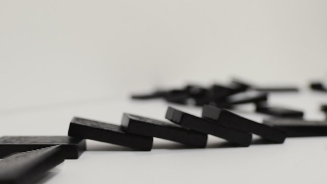 domino effect, black wooden domino line curve