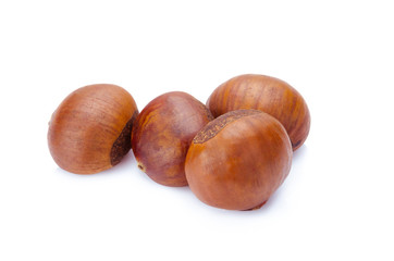 Fresh chestnuts isolated on white