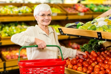 Senior woman picking out some vegetables
