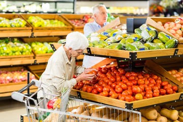 Senior couple buying food at the grocery