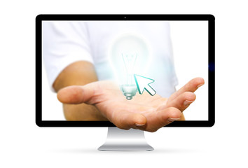 Businessman escaping from computer holding lightbulb