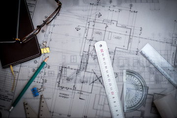 Construction planning drawings on the table with pencils, ruler
