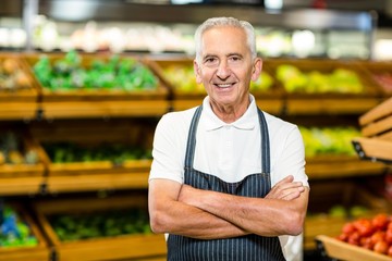 Senior worker with arms crossed