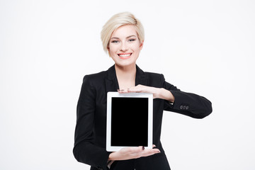 Businesswoman showing blank tablet computer screen