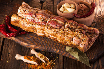 Pork knuckle on a wooden background. Preparation