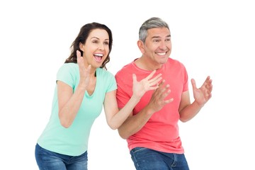 Excited couple cheering 