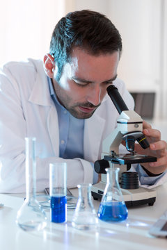 Young attractive man working in a laboratory