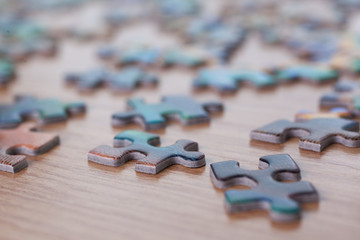  Puzzles on a wooden surface closeup