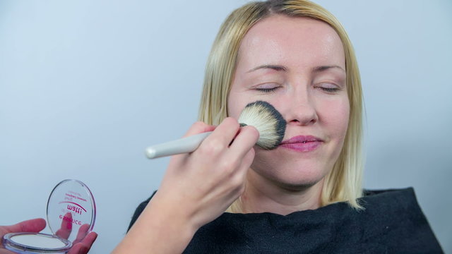 Beautician using the brash 