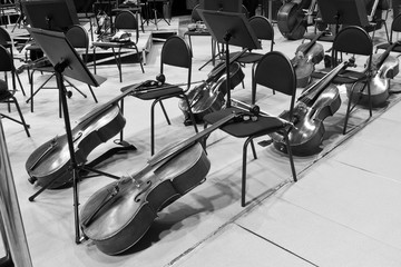 Cello lying on the stage in a symphony orchestra in black and white