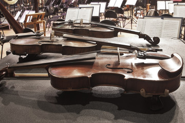  Violin lying on the stage in a symphony orchestra