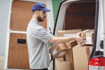 Delivery man holding packages