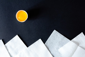 Landscape made up of broken eggs, parsley and white napkins