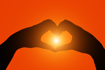 silhouette hands  heart shape with sun in the middle 