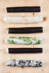 Homemade sushi rolls on cutting board