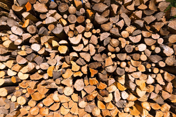 Pile of Chopped Firewood / Background of dry chopped firewood logs in a pile