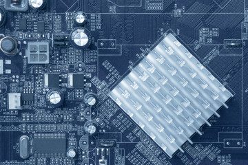 Circuit board with electronic components. Computer and networking communication technology concept. Tinted image.