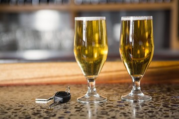 View of two pints of beer and car keys