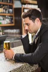Tired man having a beer