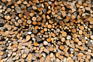 Pile of Chopped Firewood / Background of dry chopped firewood logs in a pile