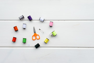 Set for sewing. Color threads, scissors, thimble, pin, button
