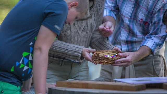Couple gives the children some candy.