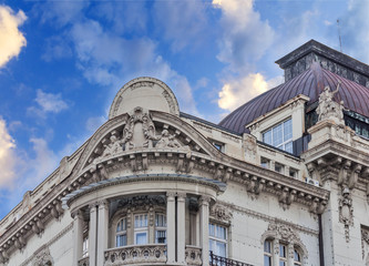 Fototapeta na wymiar Historic building detail with dramatic blue cloudy sky