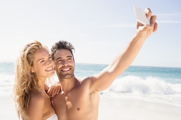 Fototapeta premium Smiling couple taking selfie
