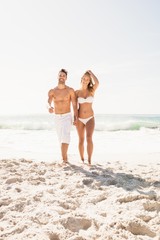 Young couple holding hands