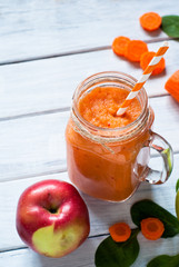Orange smoothie from carrot and apple.