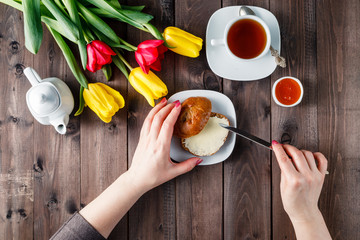 woman buttering bread