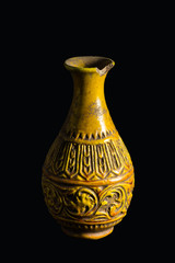 Vase on a traditional with isolated on black background.