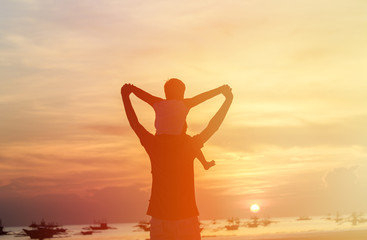 Fototapeta premium happy father and son on sunset beach