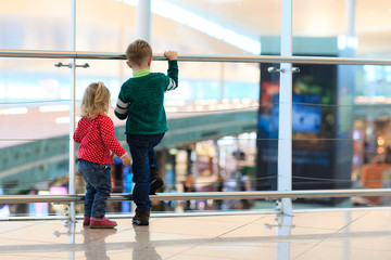 kids -little boy and girl-waiting in the airport