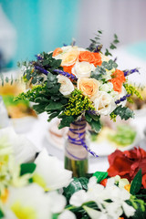 Wedding bouquet on a table at banquet.