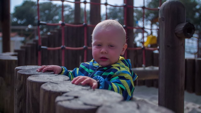 Child on a wooden playground