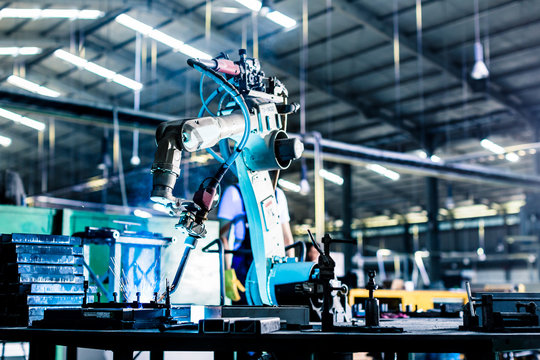 Welding robot in production plant or factory