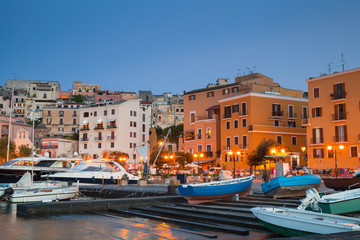 Old port with moored motorboats and yachts
