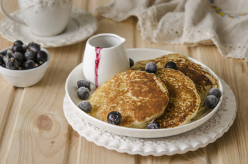 Pancake with jam from the black currant for a breakfast   