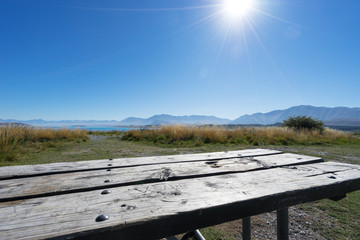 old wood floor on ground near lake in summer day in new zealand