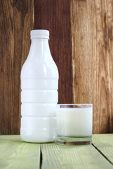Obraz na płótnie Canvas Bottle and glass of yoghurt