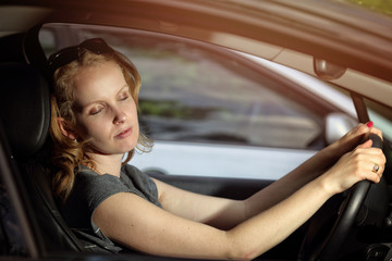 Obraz na płótnie Canvas Tired girl standing in a traffic jam