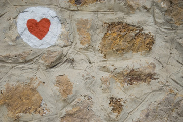 red heart on the stone wall