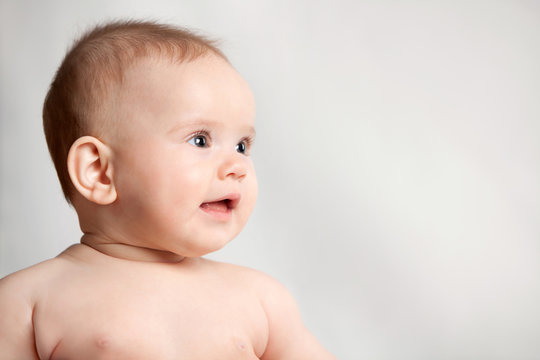 portrait of a beautiful little baby on a white background
