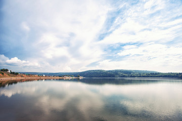 Obraz premium big lake and clouds which are reflected in it